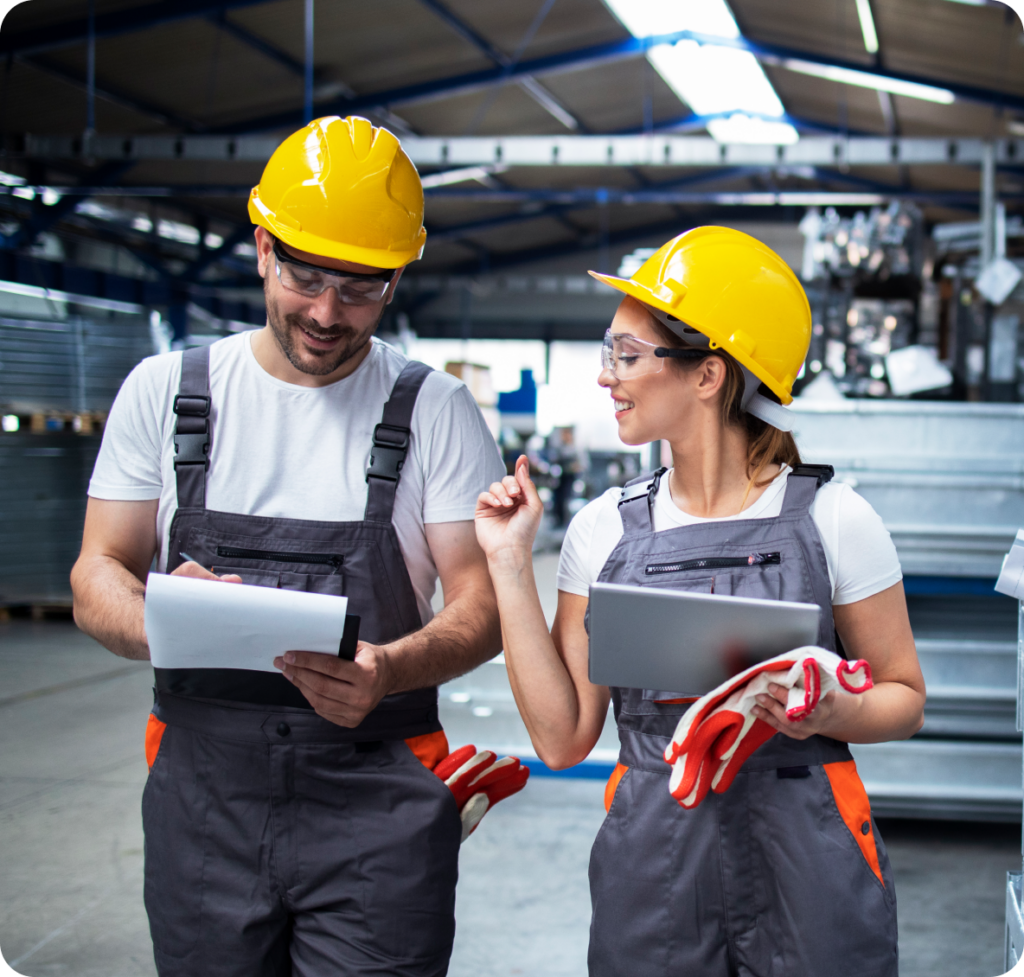 Factory workers discussing at the production site
